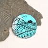 Patterned fields brooch