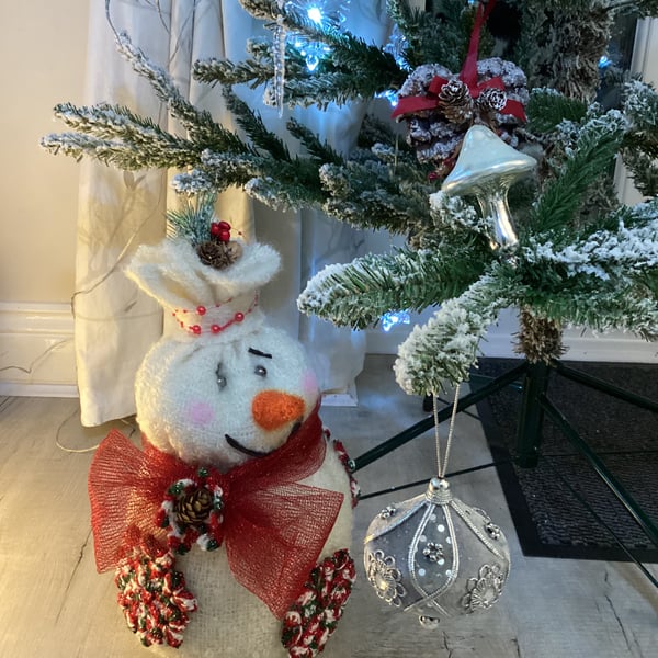 Snowman, large snowman, snowflakes on snowman