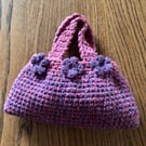 Small pink and purple crochet stash bag with flowers