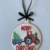 896.  Tractor pulling tree Christmas tree hanging ornament. 