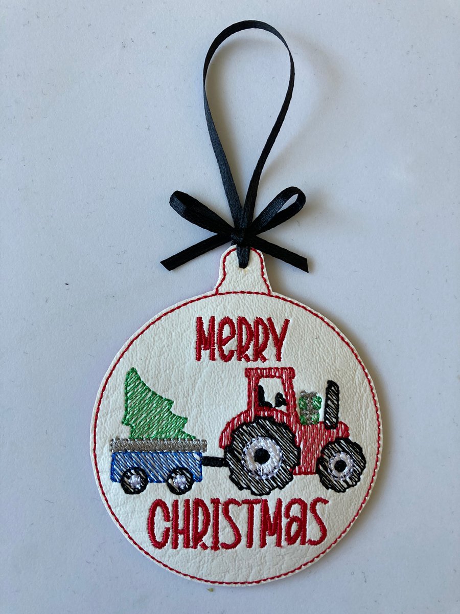 896.  Tractor pulling tree Christmas tree hanging ornament. 