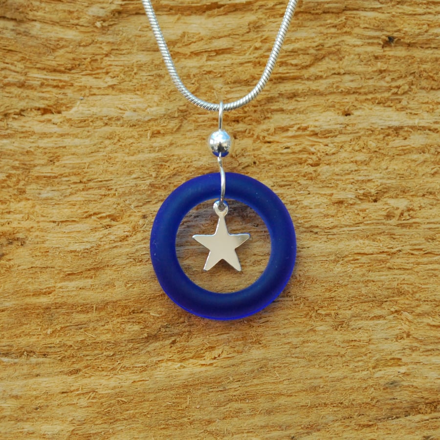 Blue glass ring pendant with silver star