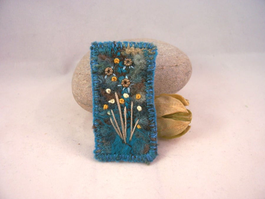 Needle felted and hand embroidered brooch 