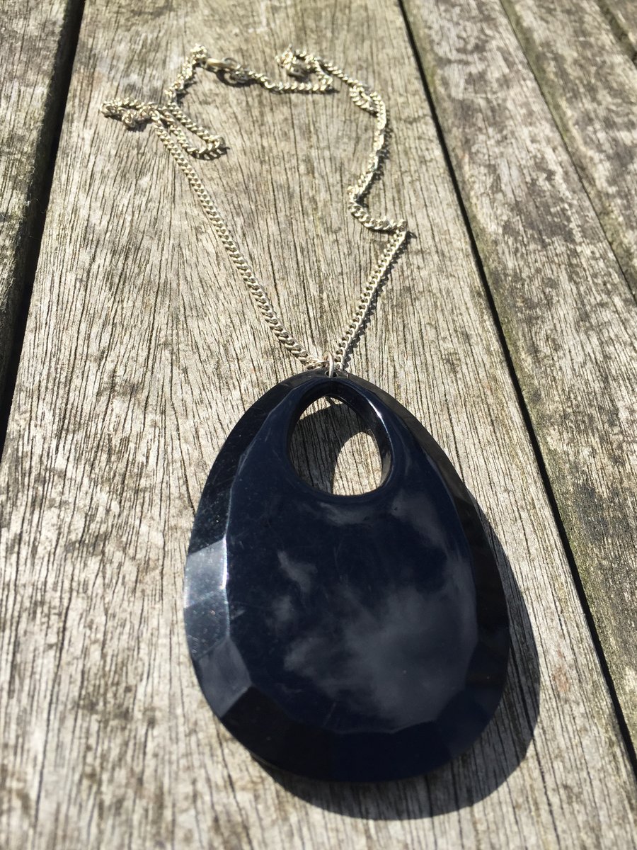 Black pendant on silver plated chain