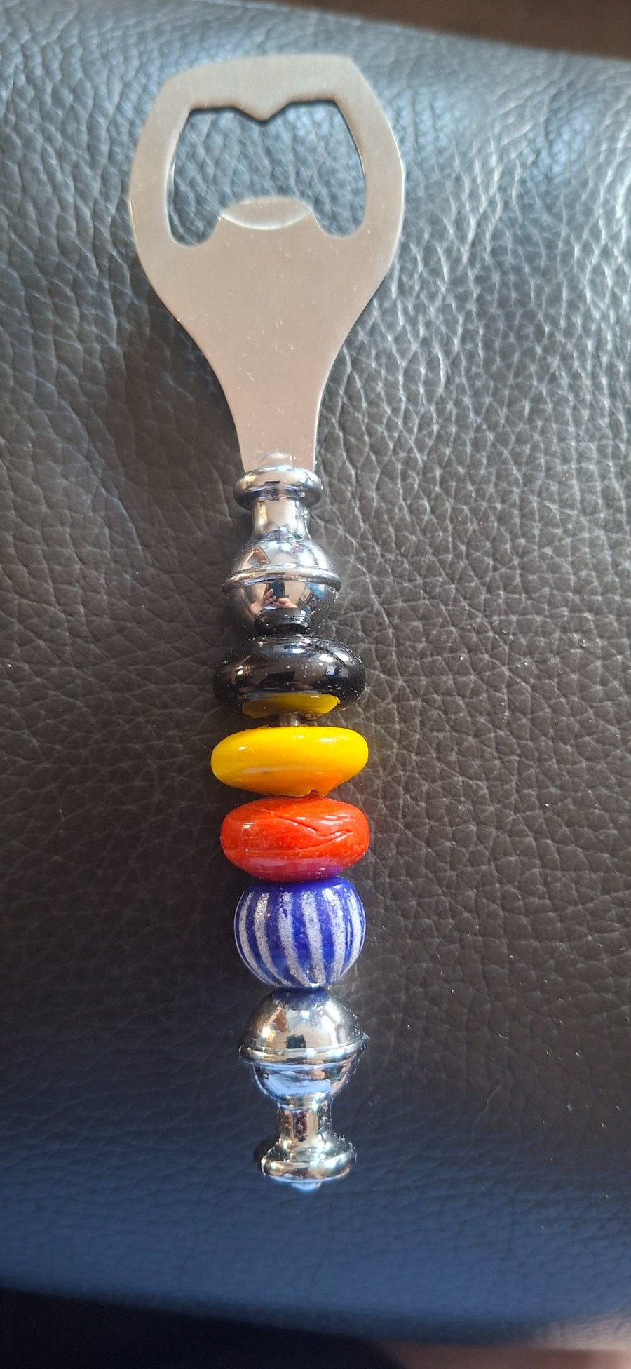 Glass beaded bottle open