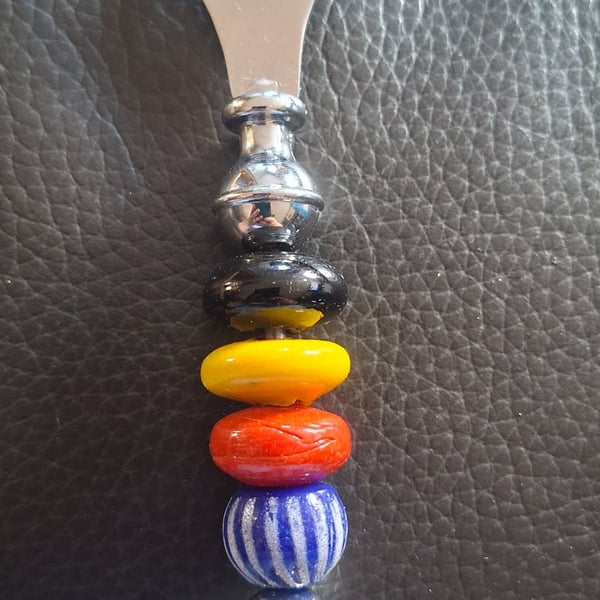 Glass beaded bottle open