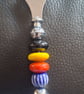 Glass beaded bottle open
