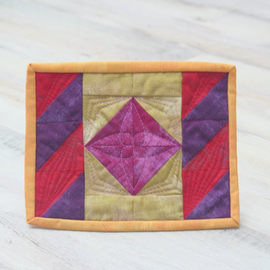 Colourful traditional patchwork Mug Rug