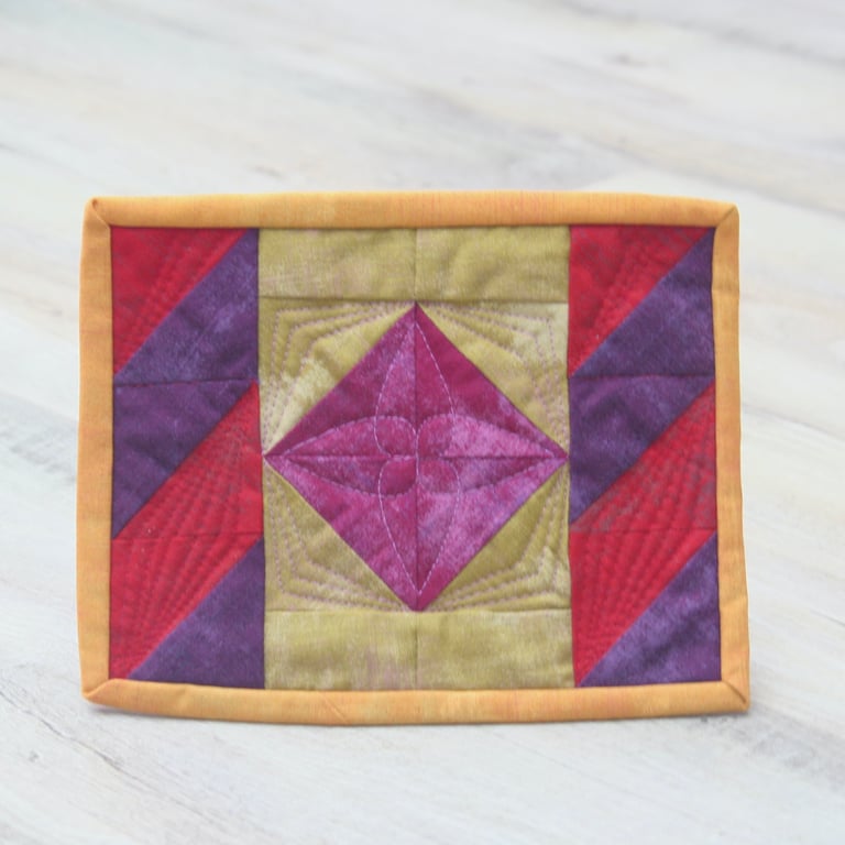 Colourful traditional patchwork Mug Rug