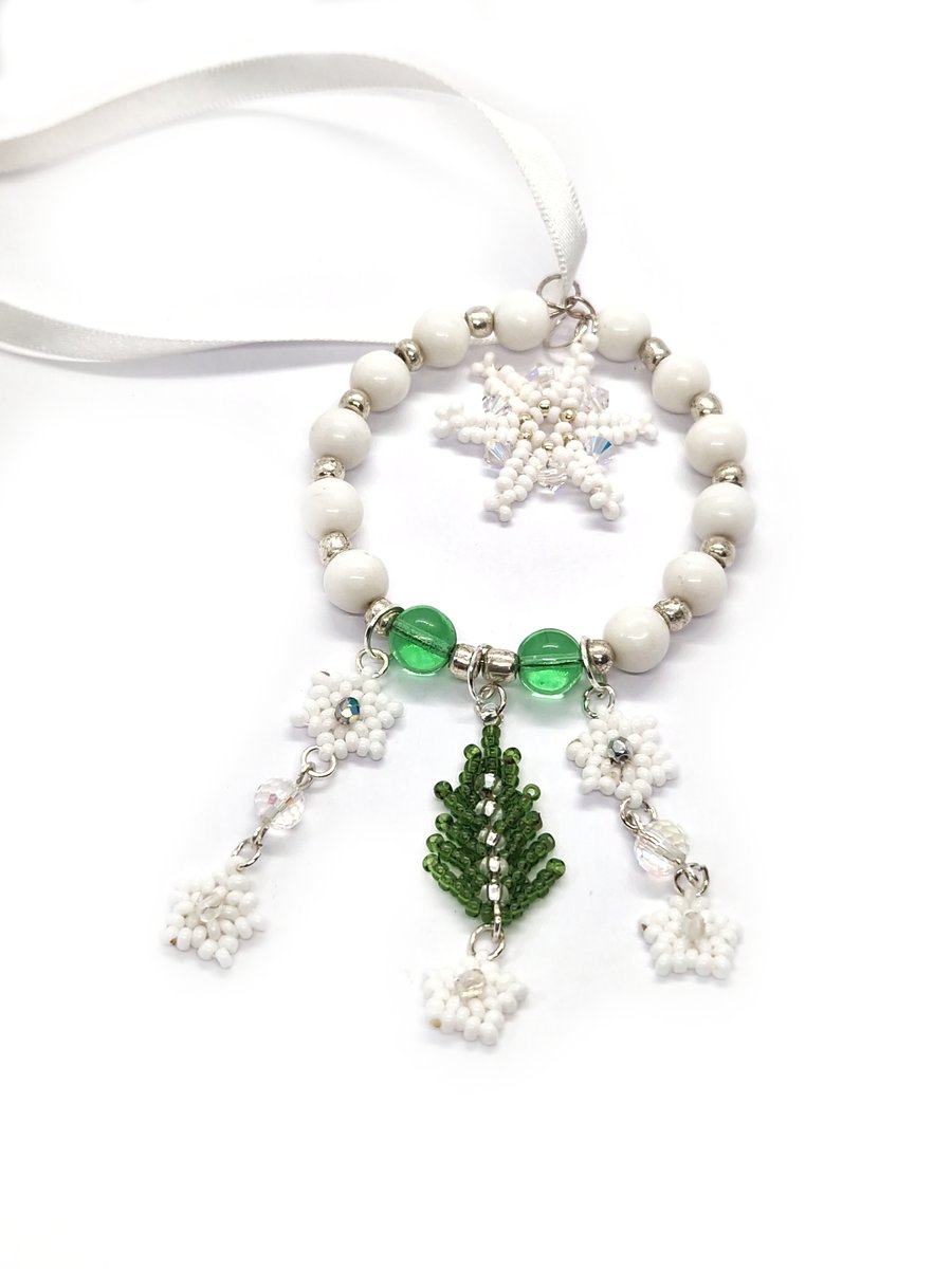 White and green Christmas tree and snowflakes hanging decoration