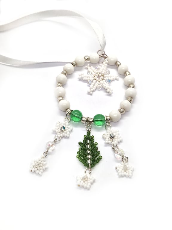 White and green Christmas tree and snowflakes hanging decoration