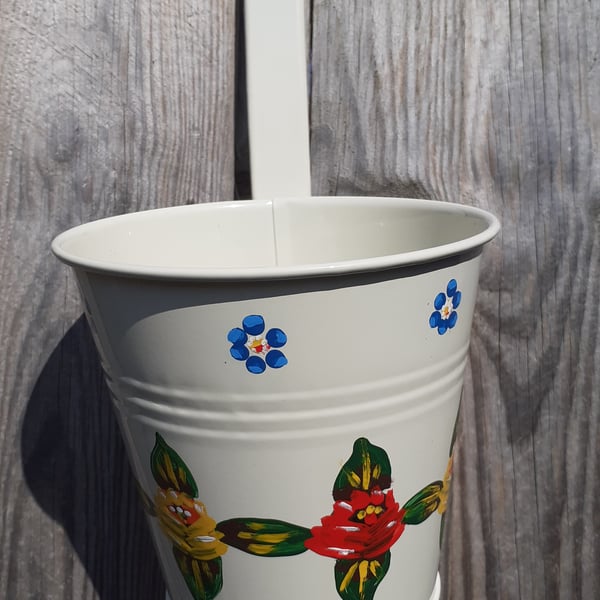 Round hanging planter handpainted with canal art style roses and daisies