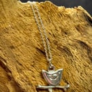 Silver bird sitting on twig pendant 