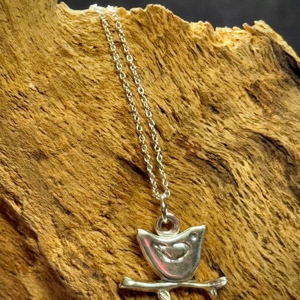 Silver bird sitting on twig pendant 