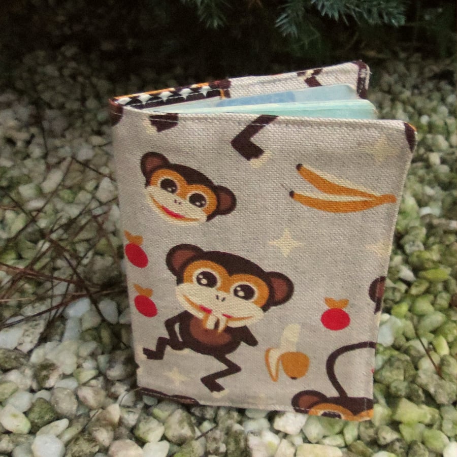 Monkey.  A passport cover with a monkeys design.  Passport sleeve.