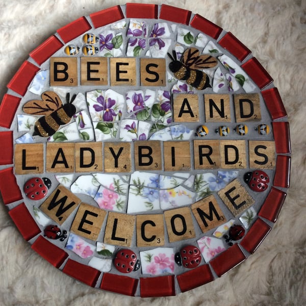 Bees and ladybirds welcome sign