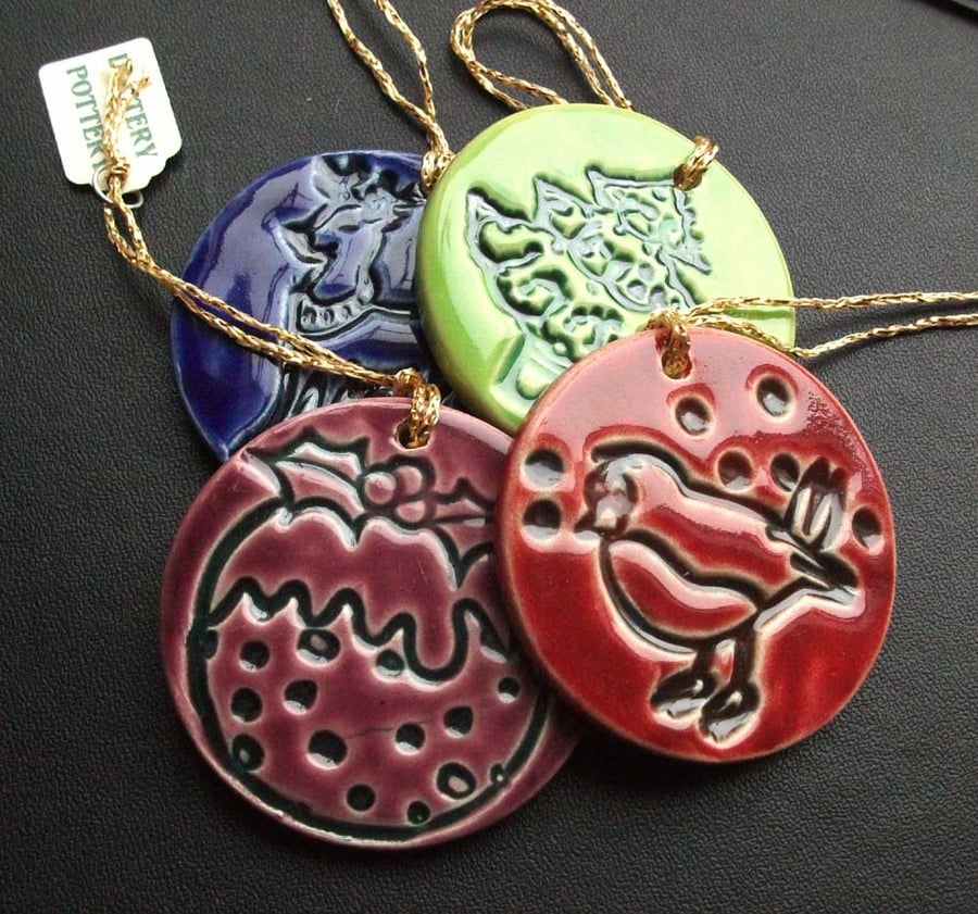 Set of four bright ceramic Christmas decorations