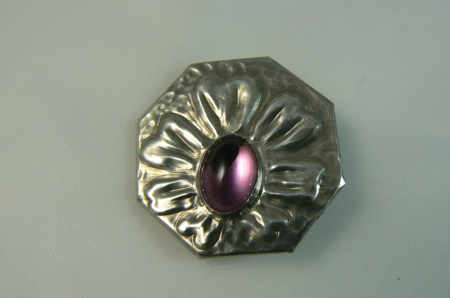 Pewter brooch with purple gemstone