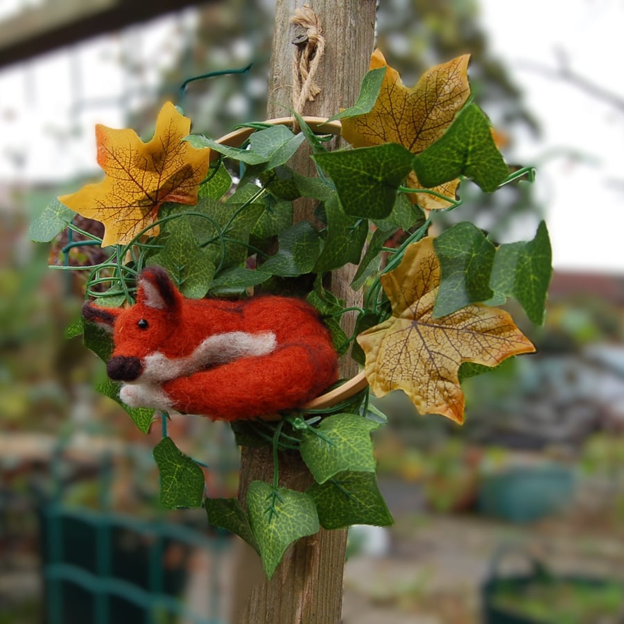 Wall decoration.  Fox curled up amongst ivy in the wood, needle felt fox