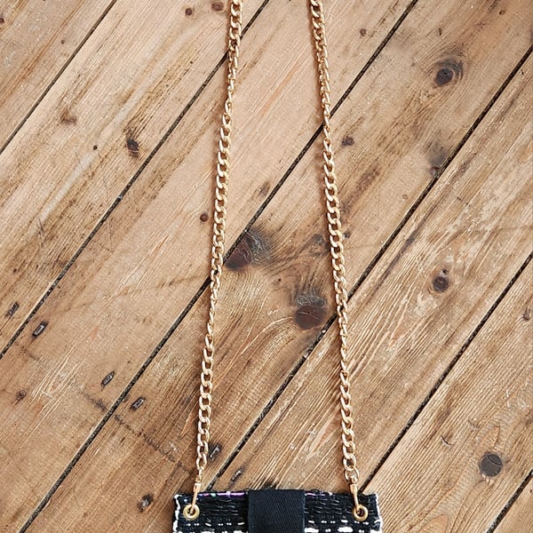 BLACK AND IVORY BOUCLE MOBILE CARRIER WITH CHAIN STRAP