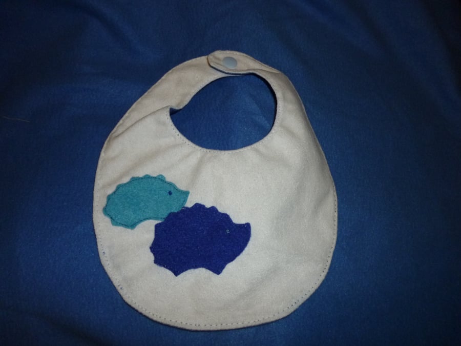 Hand made appliqued baby bib - hedgehogs motif blue & white