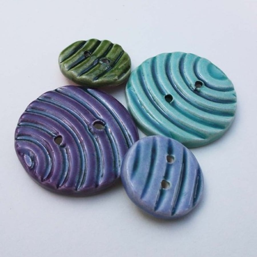 Set of four stripey ceramic buttons