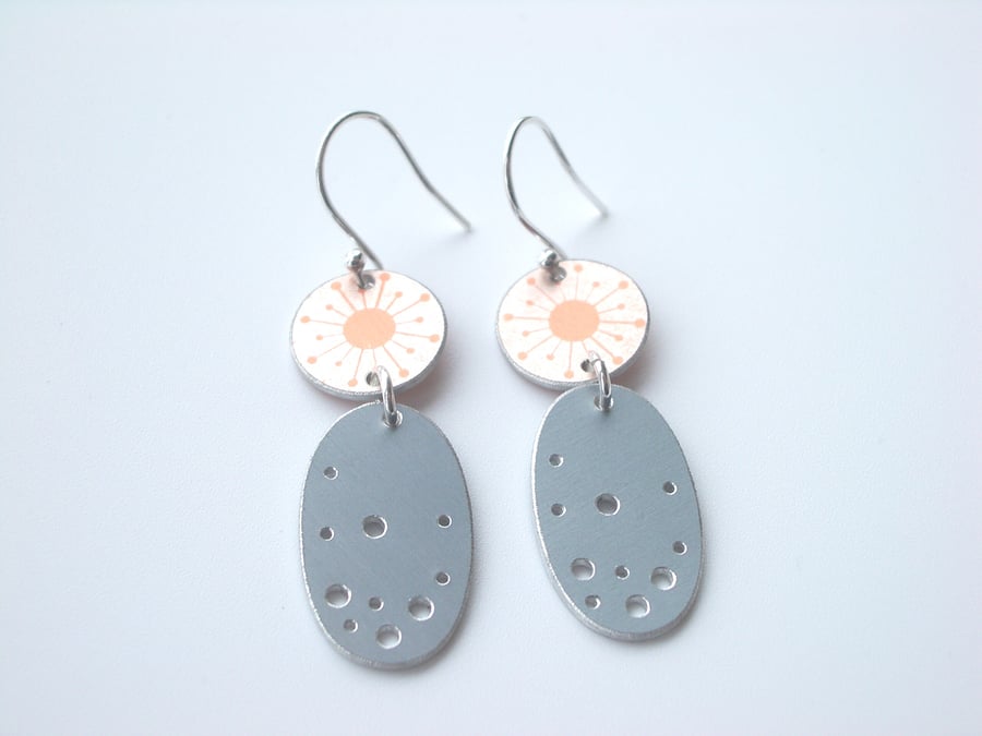 Orange and grey dangly earrings with starburst