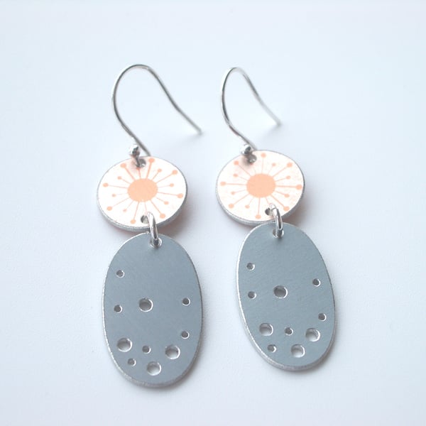 Orange and grey dangly earrings with starburst