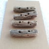 Four driftwood toggle buttons