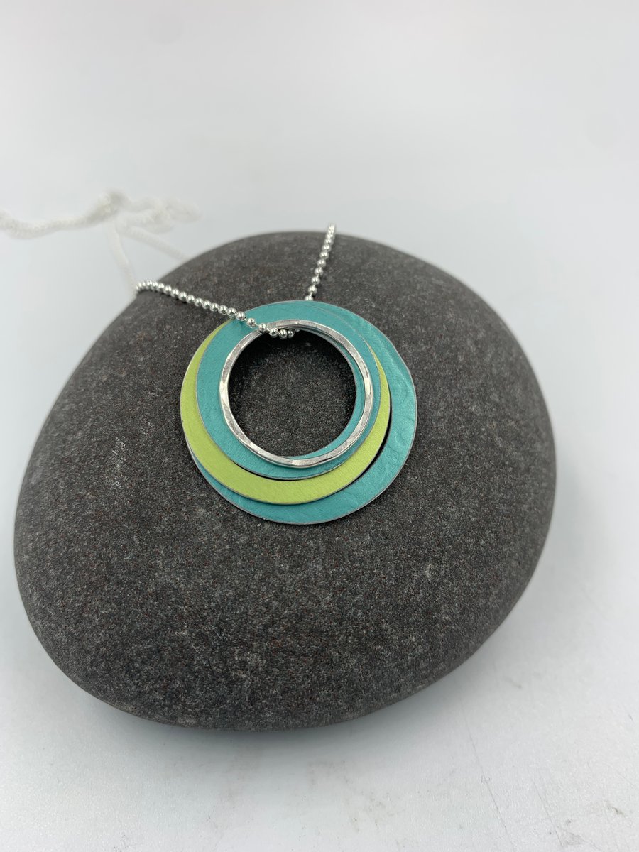 Ripples circle pendant in teal and lime with recycled silver ring
