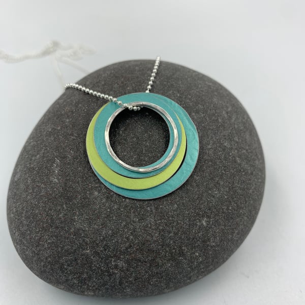 Ripples circle pendant in teal and lime with recycled silver ring