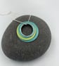 Ripples circle pendant in teal and lime with recycled silver ring - Image 1