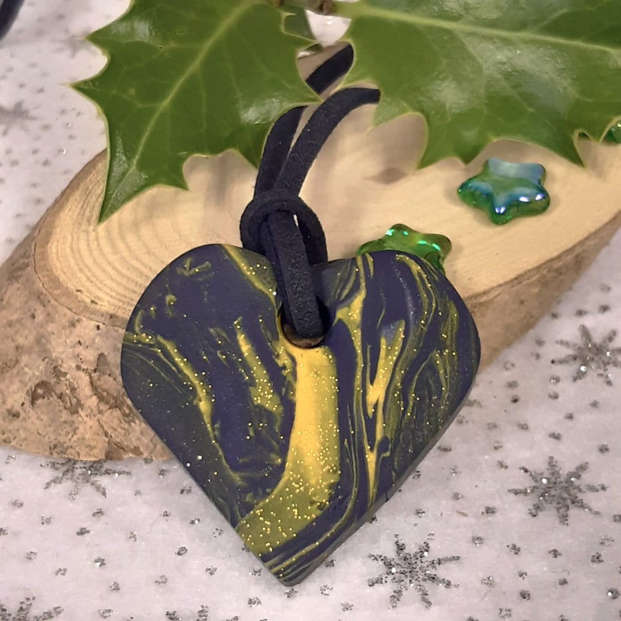 Polymer clay heart shaped pendant with a touch of sparkle
