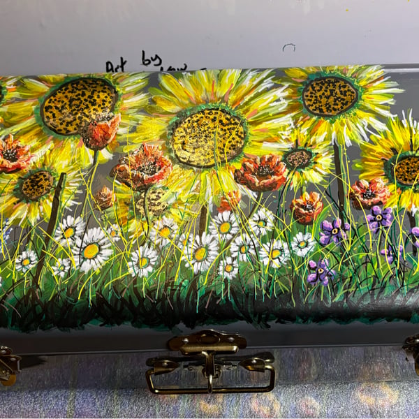 A hand painted and varnished metal trunk by Andrew Jenkins 