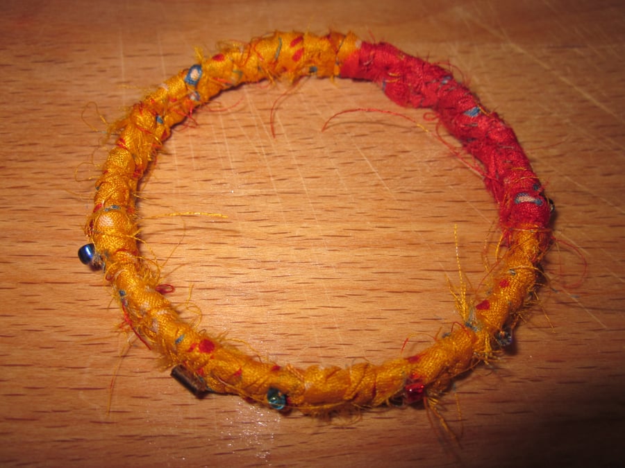 Textile bangle 'Strelitzia' small to medium - recycled sari silk