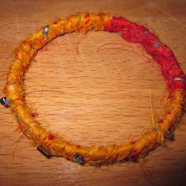 Textile bangle 'Strelitzia' small to medium - recycled sari silk