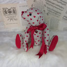 Esme, heart print teddy bear
