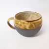 Mug huggable Wheel thrown Black clay Striped.