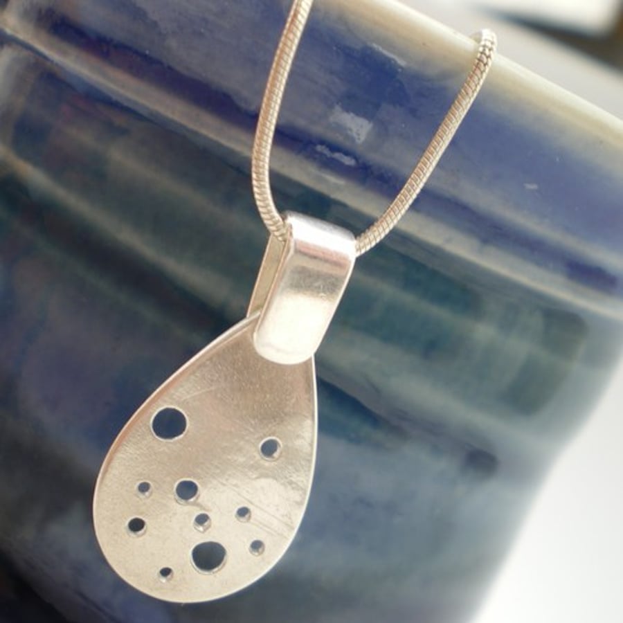Circles Cut Out Teardrop Silver Pendant