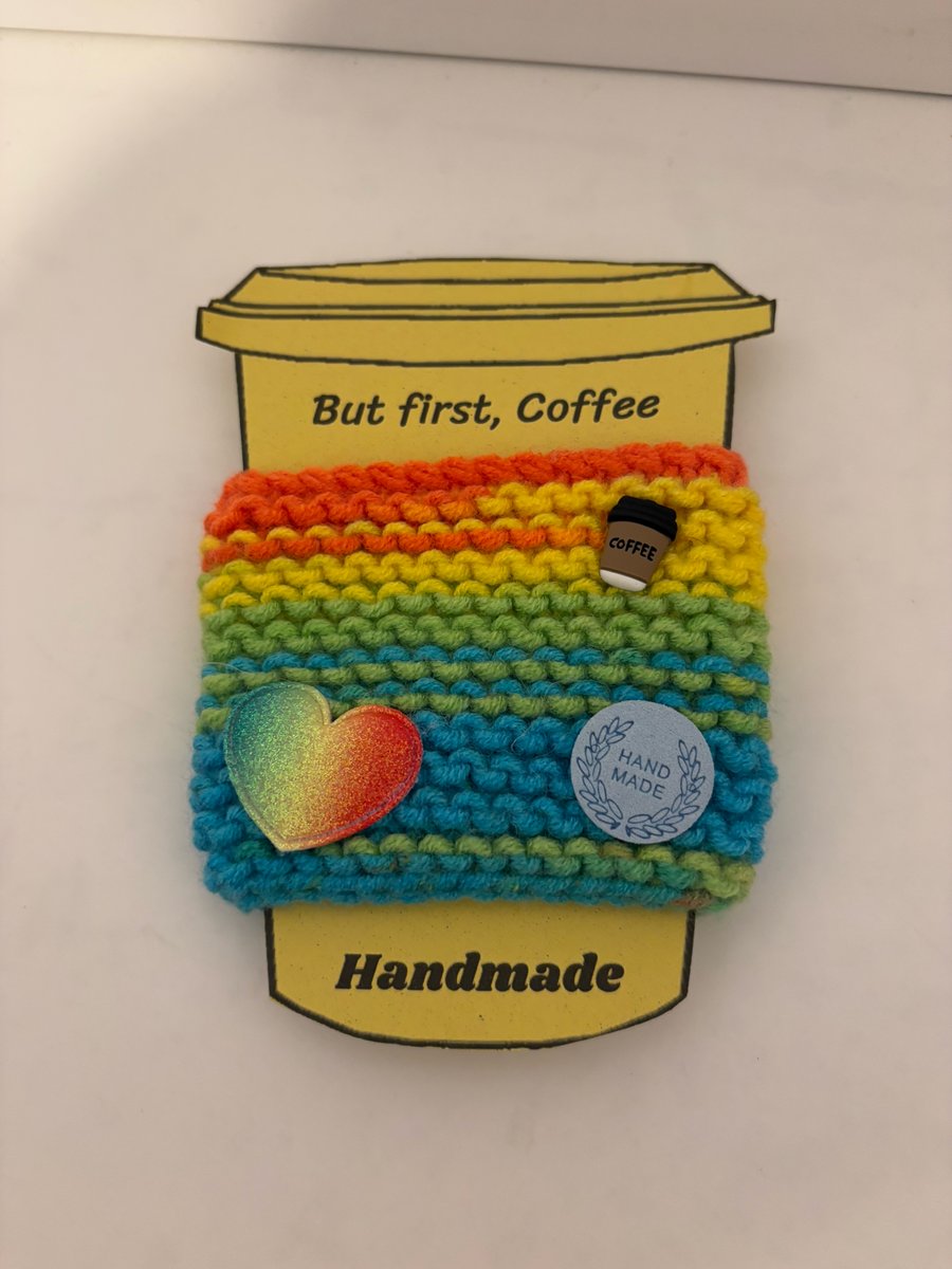 Rainbow heart knitted cup cosy. 