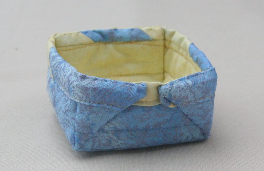 Small Quilted storage box featuring glittery blue and yellow fabric.
