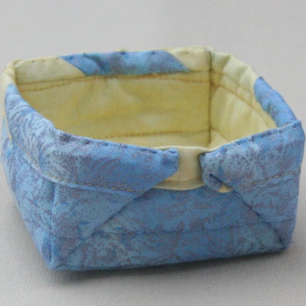 Small Quilted storage box featuring glittery blue and yellow fabric.