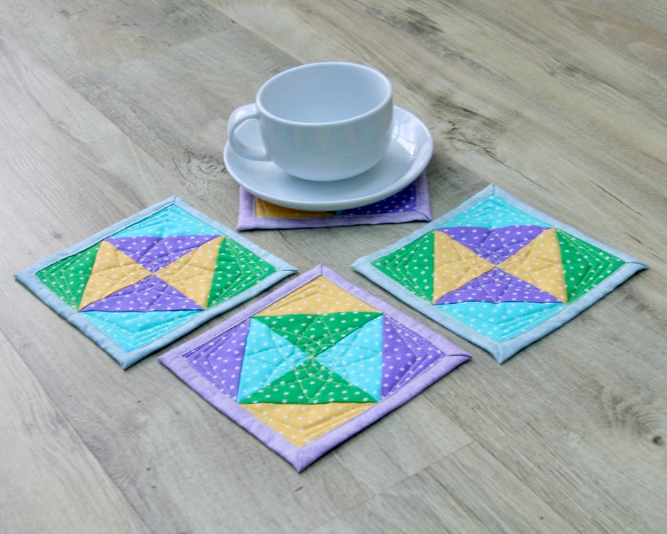 Coaster Set - four coasters with Green, Yellow, Blue and Purple stars fabric.