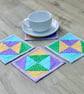 Coaster Set - four coasters with Green, Yellow, Blue and Purple stars fabric. - Image 1