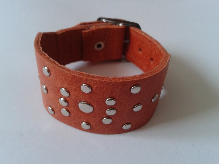 orange leather adjustable wristband with rivet design