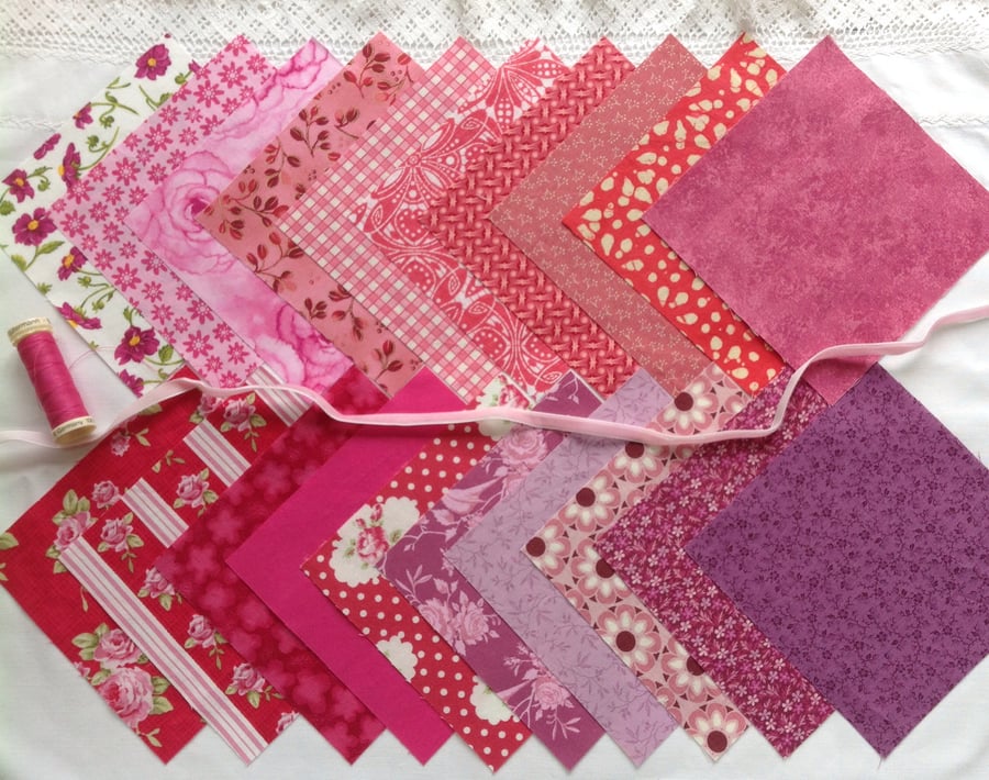 Charm squares in pinks and purples.