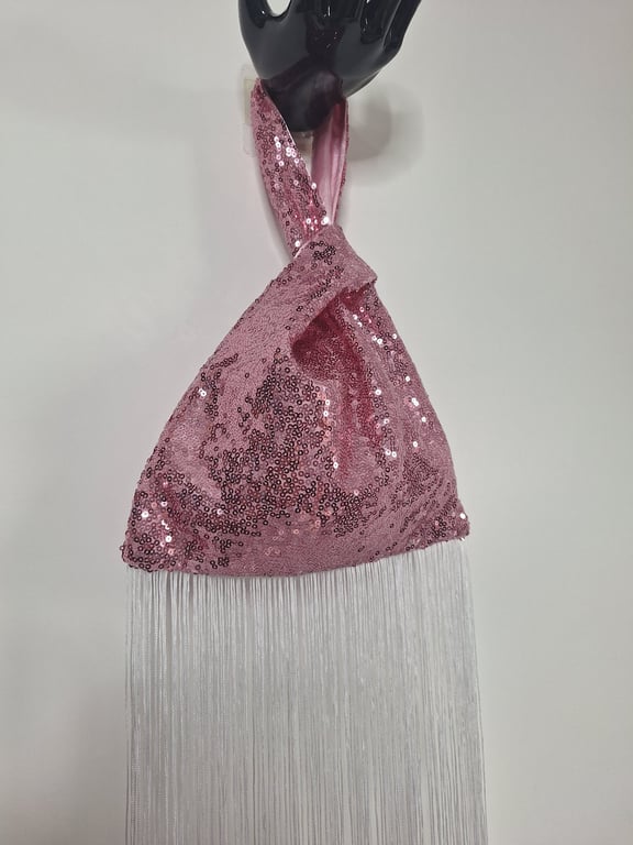 Pink sequin Japanese Knot bag with 27cm tassel trim and satin lining.