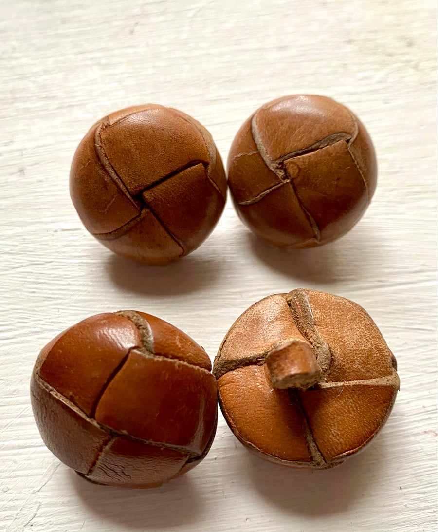 4 vintage leather buttons