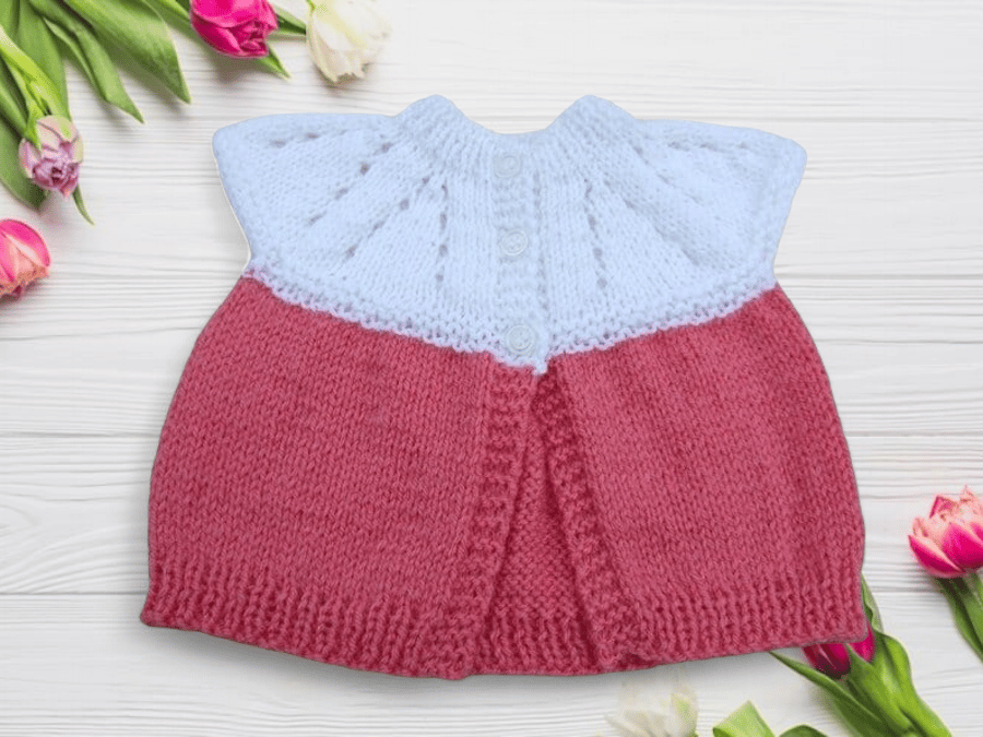 Baby sleeveless cardigan hand knitted in white and deep pink