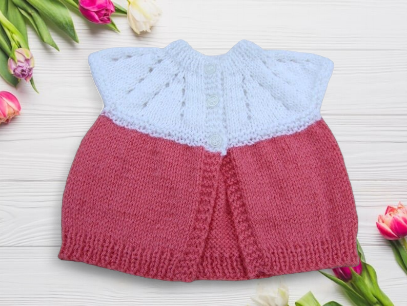 Baby sleeveless cardigan hand knitted in white and deep pink